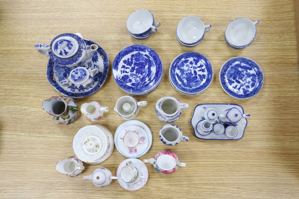 A collection of Victorian Staffordshire childrens blue and white tea ware, in a miniature armoire, height 59cm